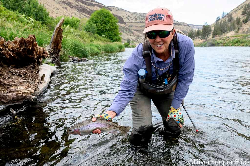 Dancingtrout Holding Rainbow by Island | www.johnkreft.com